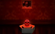 Pedestal holding a Red Skull within a hallway, with a painting depicting Vanitas above it