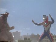 Imit-Ultraman Dyna easily beats down a powered-up Monsarger, demonstrating his superior strength