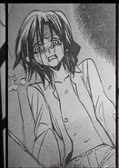 Sayo as she appears in the EP8 manga, horrified as she learns of her own disfigurement.