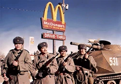 McSoldiers standing at attention with their McTank