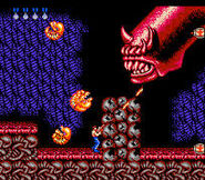 Red Falcon's head in the original Contra, shooting its babies at Bill Rizer.