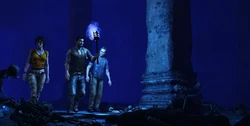Nate, Chloe, and Sullivan exploring the last refuge of Polo's crew with a torch using the blue resin