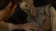 Nate touching Sir Francis' dead body.