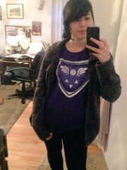 A selfie of Temmie wearing a Delta Rune shirt