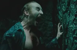 Marcus screaming in rage.