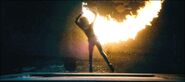 Selene escaping fire from flamethrower