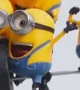 A small one eye Minion with slanted spiky hair.