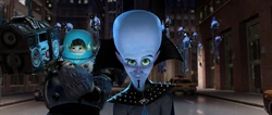 Megamind and Minion celebrating their "victory" against Metro Man.