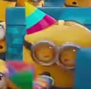 A short and plump Minion with combed hair.