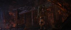 Thanos Picks Up a Defeated Hulk