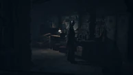 Ashley sees the Psycho in his workshop.