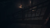 The Psycho can be seen walking the stairs underneath Sam.