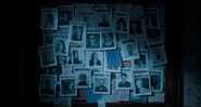 Posters of missing visitors who were trapped in the death loop