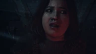 Emily noticing the Wendigo behind her.