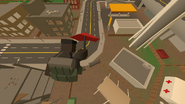 A Player falling down from a building with the Umbrella equipped.