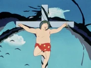 Anime director Mamoru Oshii on a crucifix in Episode 158