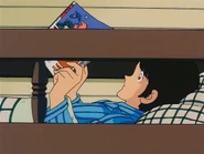 Tatsuya Uesugi read comic book with image Lum in The Touch Episode 16