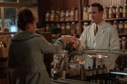 Claudia buying laudanum and arsenic