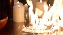 Scraps of paper with runes catch fire