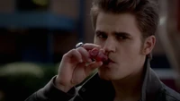 Stefan drinking Bonnie's blood