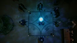 An intricate symbol with four runes