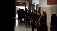 Stefan, Elena, and Caroline talking in front of the lockers in 1x16