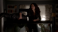 Katherine dunks Damon's head to the fish tank filled with vervain water.