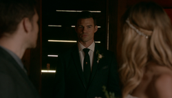 Elijah arrives to walk Freya down the aisle