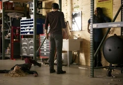Damon saves Elena from Liv's attack.