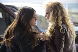 Elena and Liv fight.