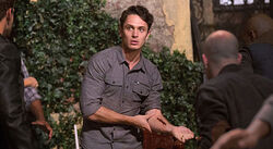 Aiden wounded and surrounded by vampires