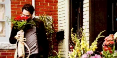Aiden smiling with a bouquet a few minutes before he was killed by Dahlia