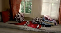 3x22: Elena's old cheer uniform in her sophomore year, a two-piece crop top uniform