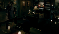 Elijah searches through his own belongings with Kol