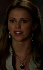 Freya wearing her talisman.