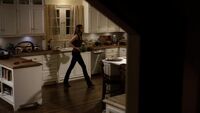 The window is now behind Elena, there's a sink under it. Notice the short kitchen counter to the right