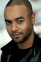 TJ Hassan as Coach Lyman