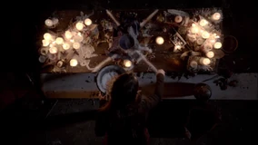 Jane Anne casts a spell, surrounded by mystical items.