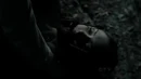 Katherine with the muzzle while Stefan and Damon were trying to rescue her.