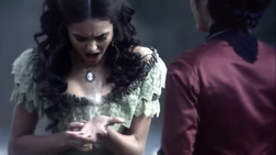 Katherine is burned by vervain