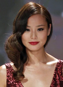 Kim in a crimson red dress.