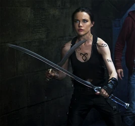 Katie wielding her blades
