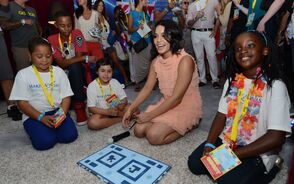 Vanessa-Hudgens-and-children-from-Make-A-Wish-Foundation-preview-Wonderbook-Book-of-Spells-at-the-PlayStation-Lounge-at-the-Variety-Power-of-Youth-Event.jpg