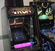 Tron video game (left) and Tron Legacy pinball machine