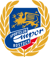 Emblem in der Zeit zwischen 1964 und dem 28. Dezember 1965. Es ähnelt dem Vorgängeremblem. Im Logo ist erneut der Rostocker Greif zu sehen.