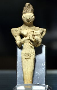 Lizard-headed nude woman nursing a child, from Ur, Iraq, c. 4000 BCE