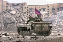 A Brolecian armoured vehicle crossing a ruined city block in Liston.