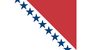 Design by "Flag Mashup Bot". The three points of the red triangle represent the demographics of the US, in this case American Indians, natural-born Americans, and naturalized Americans, alluding to the U.S. being a nation of immigrants. The stars at the top and bottom are bisected, representing a continuing Union of states and the hope that more will states will accede in the future. The red triangle also represents American Indians and North America's soil, such as Georgia's red clay and Utah's monument valley.