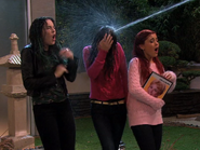 Mona Patterson spraying the girls with a hose to get them off her property