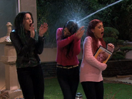 Mona Patterson spraying the girls with a hose to get them off her property